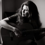 Michelle Qureshi Playing guitar