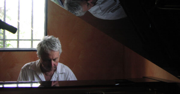 Harold Budd at Piano with Relfection