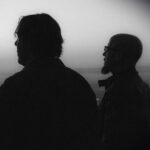 Eric "The Taaylor and David Helpling in silhouette