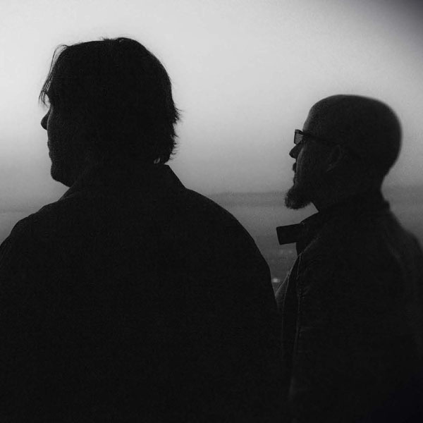 Eric "The Taaylor and David Helpling in silhouette